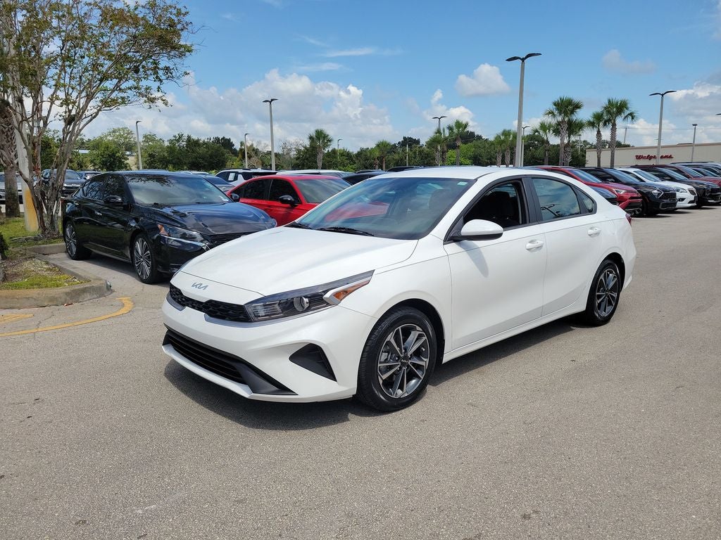 2024 Kia Forte LXS in Snow White Pearl — front three-quarter view