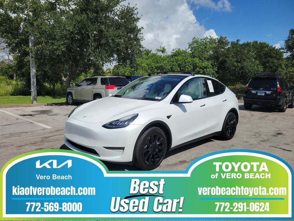 2023 Tesla Model Y Long Range in White — front three-quarter view