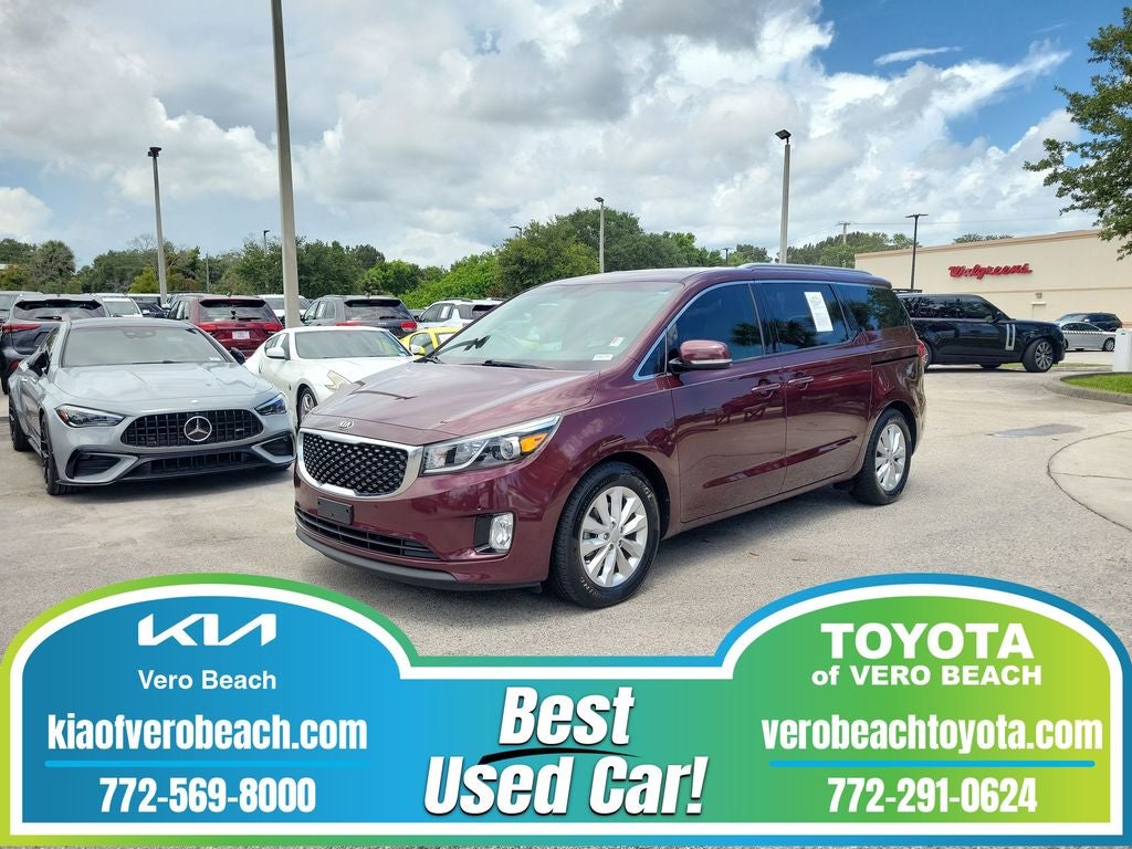 2018 Kia Sedona EX in Venetian Red Pearl Metallic — front three-quarter view